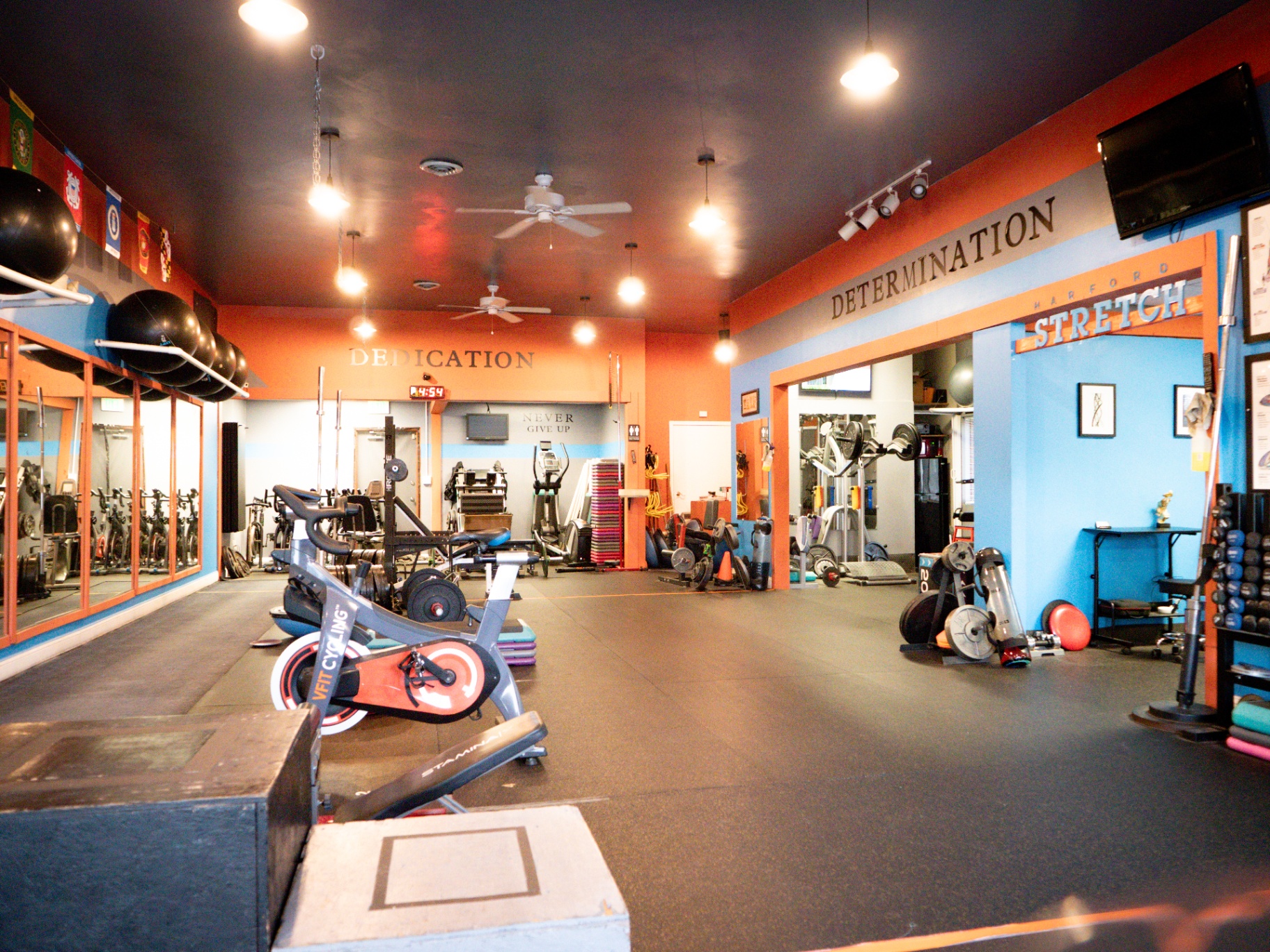 VFit training floor with Dedication and Determination wall art